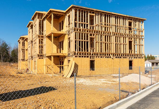 construction zone secured with a temporary fence, marked with warning signs in Boca Raton FL